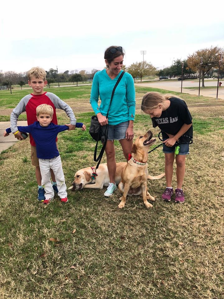 Family with Martha and Pike, two dogs adopted through from the Homes for Animal Heroes Program of NAIA